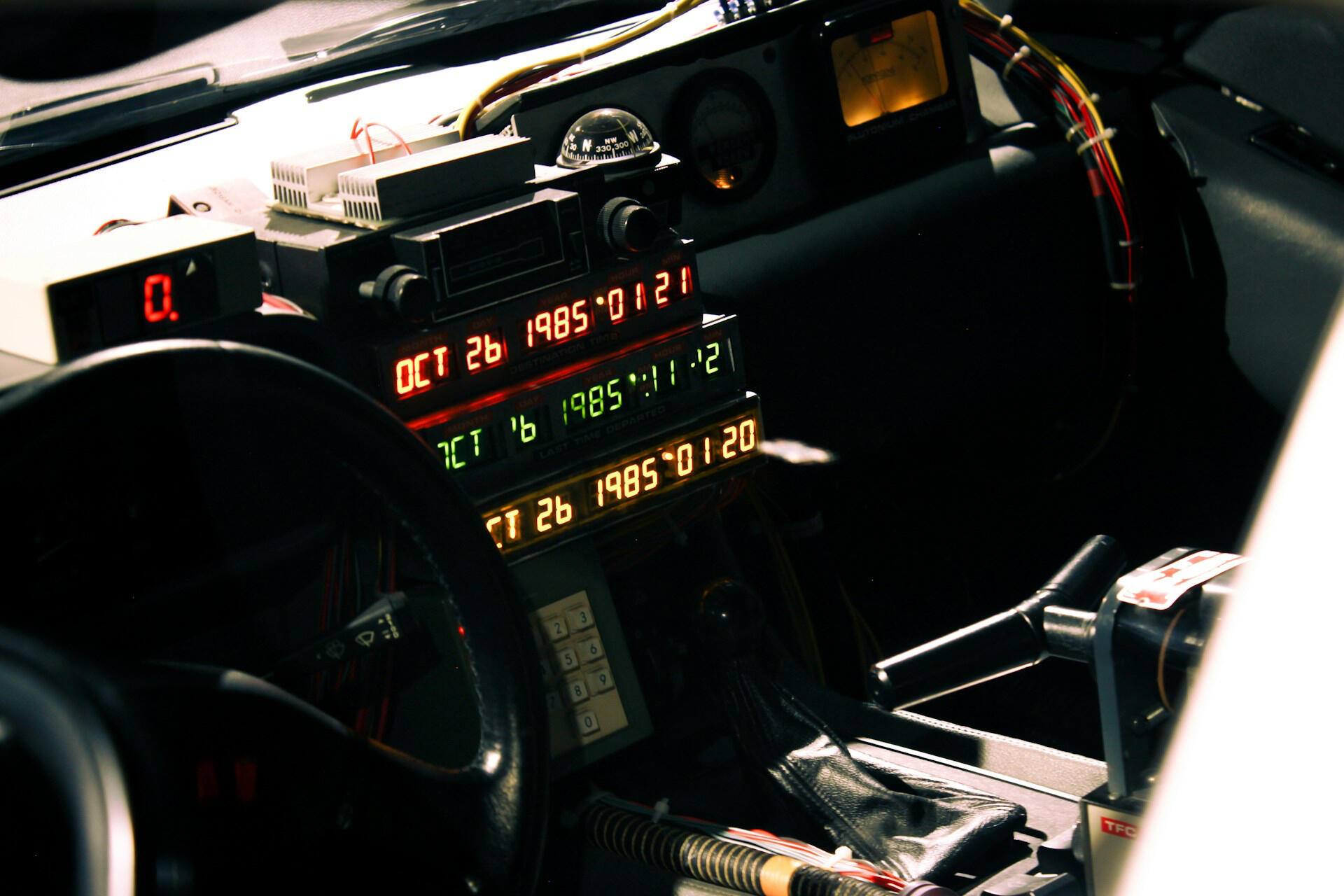 alt="Interior view of a Delorean, part of Vigatour's immersive time travel-themed experiences"